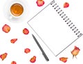 Notepad, pen, coffee cup and dried roses isolated on white background. Royalty Free Stock Photo