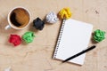 Notepad with pen, coffee and paper balls Royalty Free Stock Photo