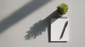 Notepad And Pen On Desk With Potted Plant Casting Shadow. Minimalist Workspace Inspiration Royalty Free Stock Photo