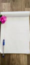 notepad with pen and flowers Royalty Free Stock Photo
