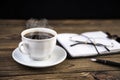 Notepad with pen, glasses, coffee on the table. Royalty Free Stock Photo