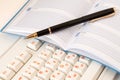 Notepad and pen on the keyboard Royalty Free Stock Photo