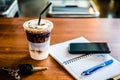 Notepad with pen, mobile phone and key car and coffee Royalty Free Stock Photo