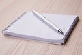 Notepad with pen on office wooden table Royalty Free Stock Photo