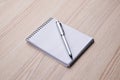 Notepad with pen on office wooden table Royalty Free Stock Photo