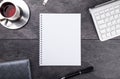 Notepad, pen, tea and keyboard on stone table Royalty Free Stock Photo