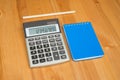 Notepad, pencil and calculator