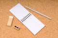 Notepad with pencil, eraser and sharpener Royalty Free Stock Photo