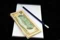 Notepad Pencil and Money Royalty Free Stock Photo