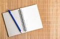 Notepad with pencil on wood board background. using wallpaper or background for education, business photo. Take note of the produc Royalty Free Stock Photo