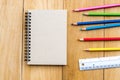 Notepad with pencil on wood board background. using wallpaper or background for education, business photo. Take note of the produc Royalty Free Stock Photo