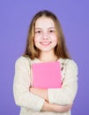 Notepad planner. Learn more. Girl hold book violet background. Kid show book notepad. Book concept. Wise quotes