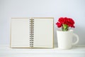 Notepad and red Carnation flower Royalty Free Stock Photo