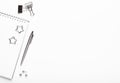 Notepad with silver stationery, paper clips, buttons and pen on a white background. Office desktop. Copy space, top view Royalty Free Stock Photo