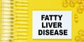 Notepad with text FATTY LIVER DISEASE closeup