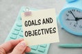 Text Goals and Objectives on wooden deskt. Business and finance concept Royalty Free Stock Photo