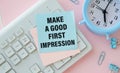 Notepad with text MAKE A GOOD FIRST IMPRESSION . White background Royalty Free Stock Photo
