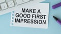 Notepad with text MAKE A GOOD FIRST IMPRESSION . White background. Business concept Royalty Free Stock Photo