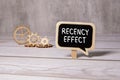 Notepad with the text Recency effect and the graph on desk. Royalty Free Stock Photo