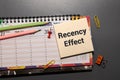 Notepad with the text Recency effect and the graph on desk. Memory and position relationship Royalty Free Stock Photo