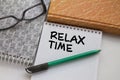 Notepad with text Relax Time with another notepad pen and eyeglasses Royalty Free Stock Photo