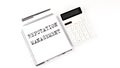 Notepad with text REPUTATION MANAGEMENT with calculator and pen. White background. Business concept Royalty Free Stock Photo