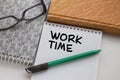 Notepad with text Work Time with another notepad pen and eyeglasses Royalty Free Stock Photo