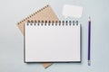 Notepad, white sticker and pensil on the desk. Mock up in copy space office background. It is important not to forget the note Royalty Free Stock Photo