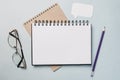 Notepad, white sticker, pensil and glasses on the desk. Mock up in copy space office background. It is important not to forget the Royalty Free Stock Photo