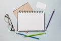 Notepad, white sticker, pensil and glasses on the desk. Mock up in copy space office background. It is important not to forget the Royalty Free Stock Photo