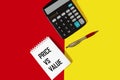 Notepad with the words Price vs value, on a red and yellow background Royalty Free Stock Photo