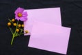 Notepaper with pink flowers cosmos ,purple flowers arrnagement flat lay postcard style