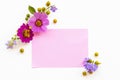 Notepaper with pink flowers cosmos ,purple flowers arrnagement flat lay postcard style