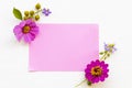 Notepaper with pink flowers cosmos ,purple flowers arrnagement flat lay postcard style