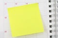 Notepaper sticking on calendar Royalty Free Stock Photo