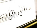 Notes close up macro on a sheet of paper. Music and sound. Royalty Free Stock Photo