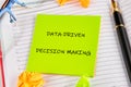 Notes on data-driven decision making with colorful reminders on a workspace desk