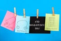 Notes hang on clothes pegs with drawings of children's inventions - popsikl, Earmuffs, calculator on a blue background. Text - Ki