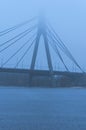 Nothern Moscow Bridge in thick fog. Misty landscape. Bad autumn weather. The concept of foggy weather in the city. Kyiv, Ukraine