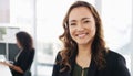 Nothing better than a positive leader. Portrait of a confident young businesswoman working in a modern office with her Royalty Free Stock Photo