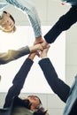 Nothing builds a business like teamwork. a group of businesspeople joining their hands in solidarity. Royalty Free Stock Photo