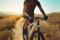 Nothing compares to the simple pleasure of a bike ride. an adventurous woman out cycling in the countryside.