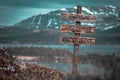 Nothing is impossible text quote engraved on wooden signpost outdoors in landscape looking polluted Royalty Free Stock Photo