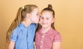 Nothing like sisterly love. Adorable girl kissing her little sister with love. A moment of pure love between small