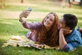 Nothing makes a good picture like love does. Portrait of a young couple taking a selfie while out at the park. Royalty Free Stock Photo