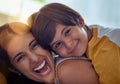 Nothing quite as endearing as the love of a mom. an adorable little boy affectionately hugging his mother at home.