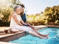 Nothing says summer like a dip in the pool. a happy senior woman spending quality time with her daughter at the pool. Royalty Free Stock Photo