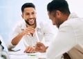 Nothing wrong with a little humour. businesspeople having a meeting in a boardroom at work.