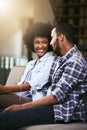 Nothing wrong with a sofa date. a young couple relaxing together on the sofa at home.