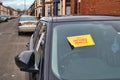 A notice is displayed on an untaxed vehicle advising that a report has been passed to the DVLA for enforcement action Royalty Free Stock Photo